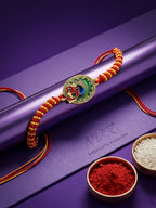 NVR Om Motif Divine Religious Thread Rakhi with Roli Chawal Chandan Mishri | Grocsy