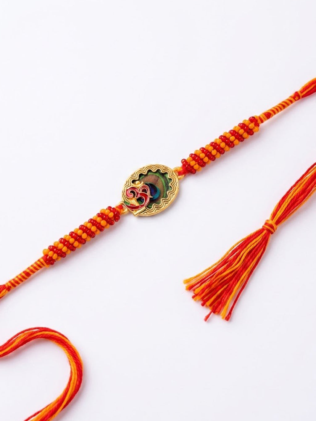 NVR Om Motif Divine Religious Thread Rakhi with Roli Chawal Chandan Mishri | Grocsy