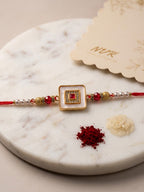 NVR Square Design Multicolor Artificial Stones & Pearls Thread Rakhi With Roli Chawal | Grocsy