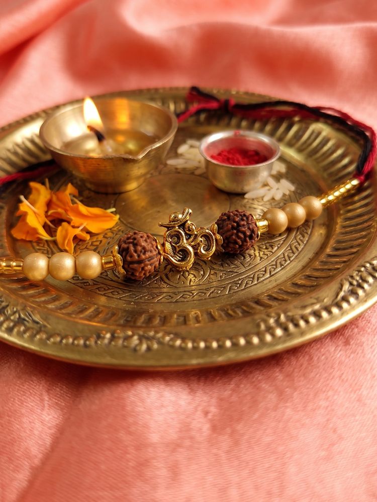NVR Om Design Rudraksh Thread Rakhi with Roli Chawal Chandan Mishri | Grocsy