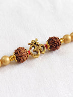 NVR Om Design Rudraksh Thread Rakhi with Roli Chawal Chandan Mishri | Grocsy