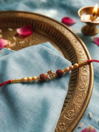 NVR Om Design Rudraksh Thread Rakhi with Roli Chawal Chandan Mishri | Grocsy