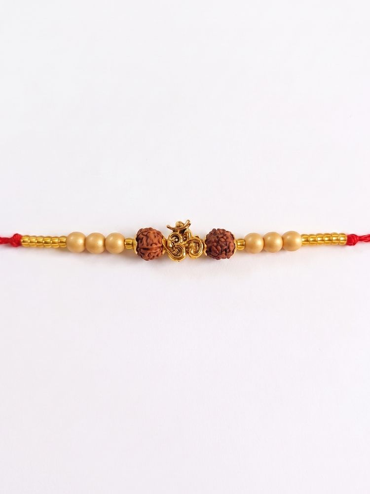NVR Om Design Rudraksh Thread Rakhi with Roli Chawal Chandan Mishri | Grocsy