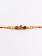 NVR Om Design Rudraksh Thread Rakhi with Roli Chawal Chandan Mishri | Grocsy