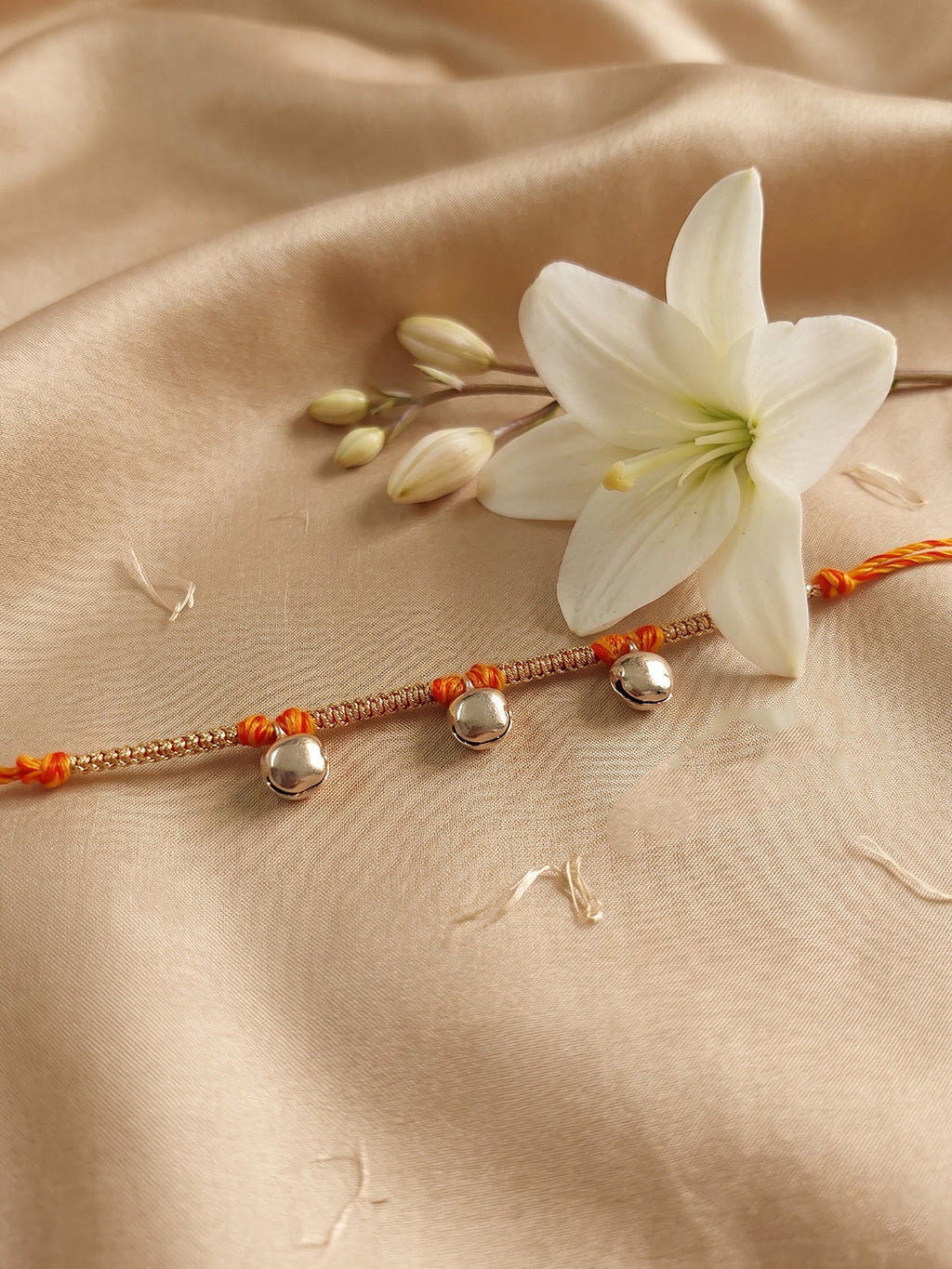 NVR Golden Ghungroo Thread Rakhi with Roli Chawal Chandan Mishri | Grocsy