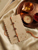 NVR Golden Ghungroo Thread Rakhi with Roli Chawal Chandan Mishri | Grocsy