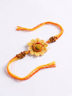 NVR Yellow Floral Seed Thread Rakhi with Roli Chawal Chandan Mishri | Grocsy