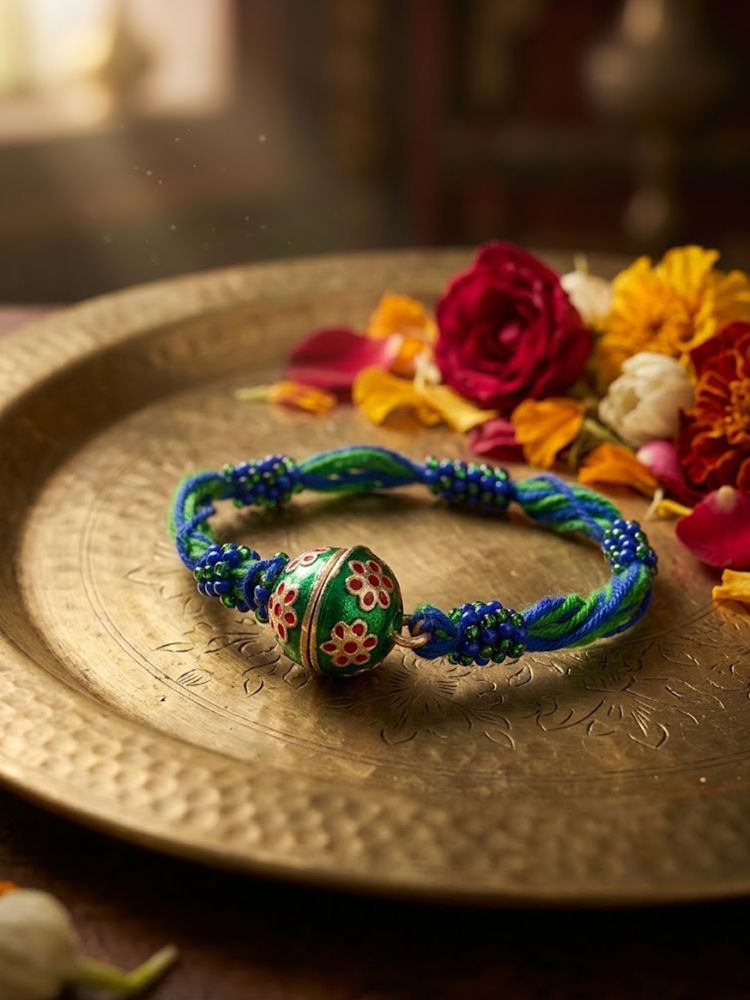 NVR Magnetic Opening Blue Meenakari Work Thread Rakhi with Roli Chawal Chandan Mishri | Grocsy