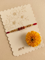 NVR Religious Rudraksh & Red Thread Rakhi with Roli Chawal Chandan Mishri | Grocsy