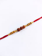NVR Religious Rudraksh & Red Thread Rakhi with Roli Chawal Chandan Mishri | Grocsy
