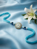 NVR Blue Evil Eye & Artificial Stones Oval Shape Thread Rakhi with Roli Chawal Chandan | Grocsy