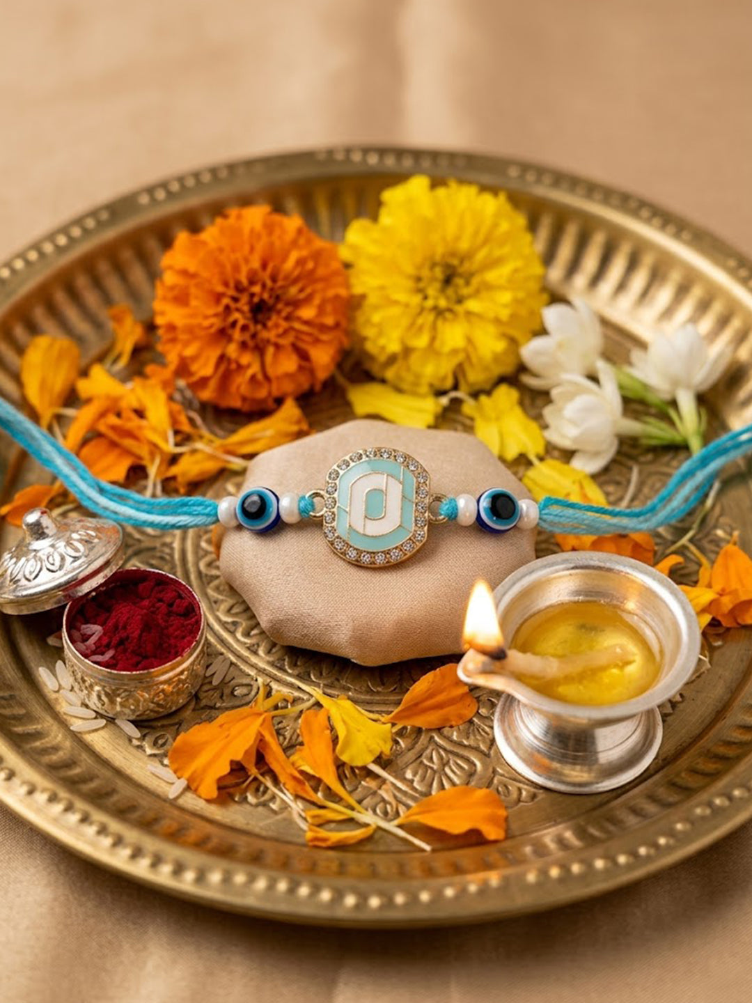 NVR Blue Evil Eye & Artificial Stones Oval Shape Thread Rakhi with Roli Chawal Chandan | Grocsy