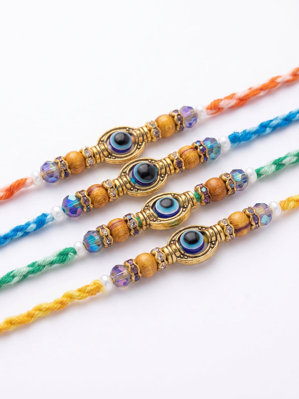 NVR Set of 4 Multicolor Evil Eye Thread Rakhi with Roli Chawal Chandan Mishri | Grocsy