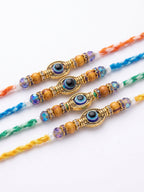 NVR Set of 4 Multicolor Evil Eye Thread Rakhi with Roli Chawal Chandan Mishri | Grocsy