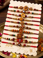 NVR Set of 10 Artificial Stones & Beads Thread Rakhi with Roli Chawal Chandan Mishri | Grocsy