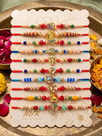 NVR Set of 10 Artificial Stones & Beads Thread Rakhi with Roli Chawal Chandan Mishri | Grocsy
