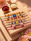 NVR Set of 7 Multicolor Designer Thread Rakhi with Roli Chawal Chandan Mishri | Grocsy