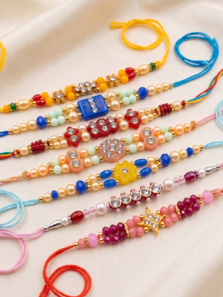 NVR Set of 7 Multicolor Designer Thread Rakhi with Roli Chawal Chandan Mishri | Grocsy