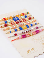 NVR Set of 7 Multicolor Designer Thread Rakhi with Roli Chawal Chandan Mishri | Grocsy