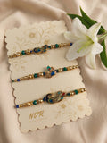 NVR Set of 3 Peacock Design Multicolor Artificial Beads Thread Rakhi With Roli Chawal | Grocsy
