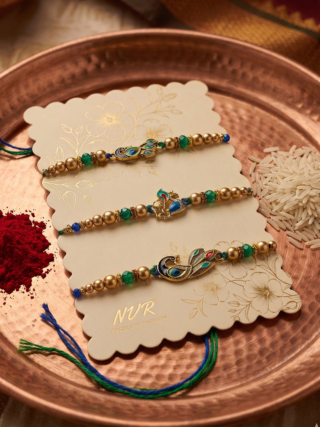 NVR Set of 3 Peacock Design Multicolor Artificial Beads Thread Rakhi With Roli Chawal | Grocsy