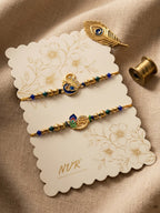 NVR Set of 2 Krishna & Peacock Design Artificial Beads Thread Rakhi With Roli Chawal | Grocsy
