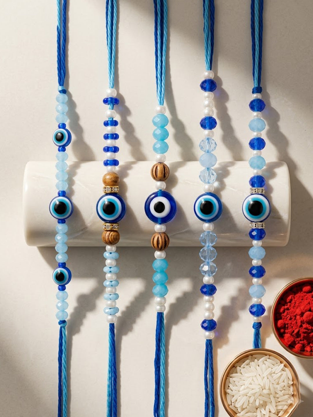 NVR Set of 5 Blue Evil Eye Thread Rakhi with Roli Chawal Chandan Mishri | Grocsy