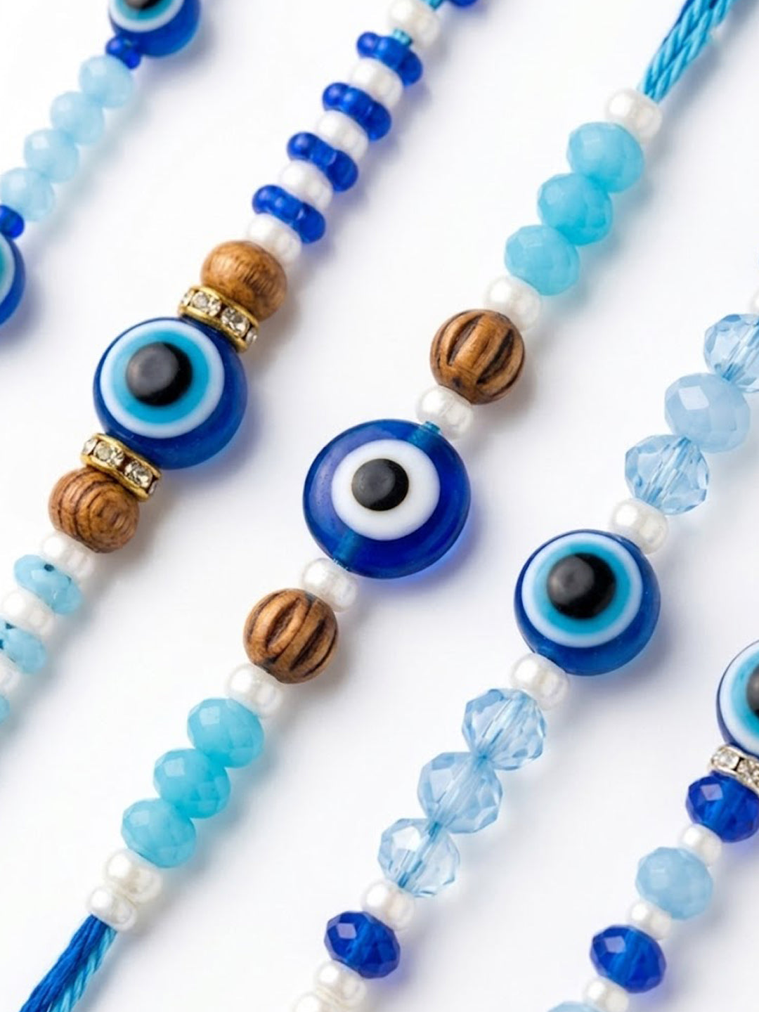 NVR Set of 5 Blue Evil Eye Thread Rakhi with Roli Chawal Chandan Mishri | Grocsy