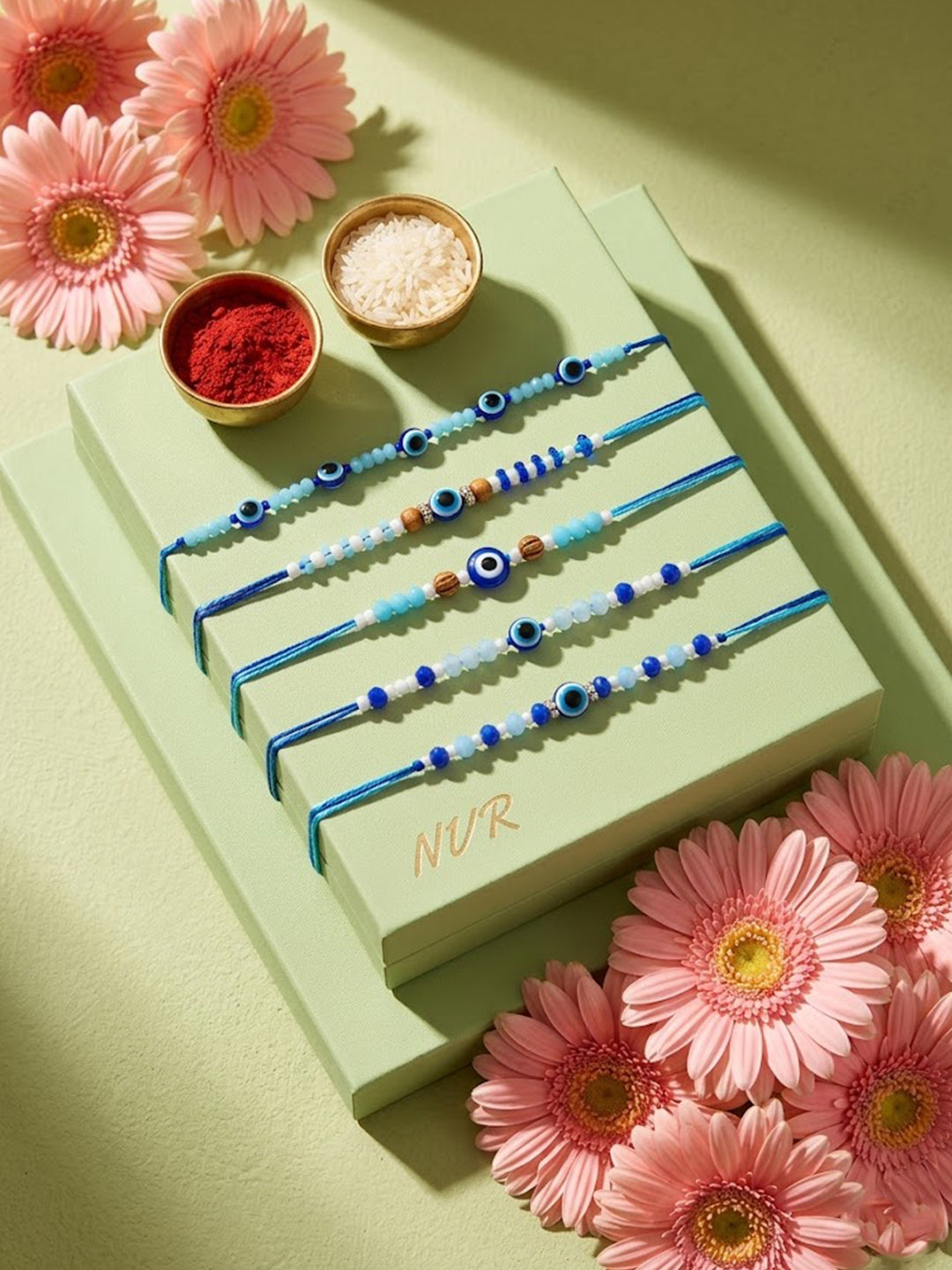 NVR Set of 5 Blue Evil Eye Thread Rakhi with Roli Chawal Chandan Mishri | Grocsy