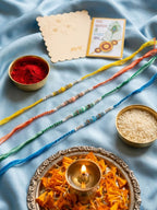 NVR Set of 4 Multicolor Artificial Beads Thread Rakhi with Roli Chawal Chandan Mishri | Grocsy