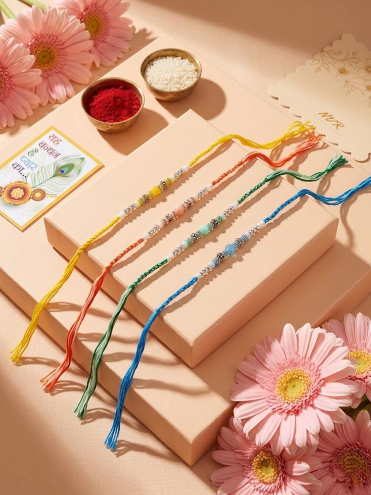 NVR Set of 4 Multicolor Artificial Beads Thread Rakhi with Roli Chawal Chandan Mishri | Grocsy