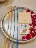 NVR Set of 4 Multicolor Artificial Beads Thread Rakhi with Roli Chawal Chandan Mishri | Grocsy