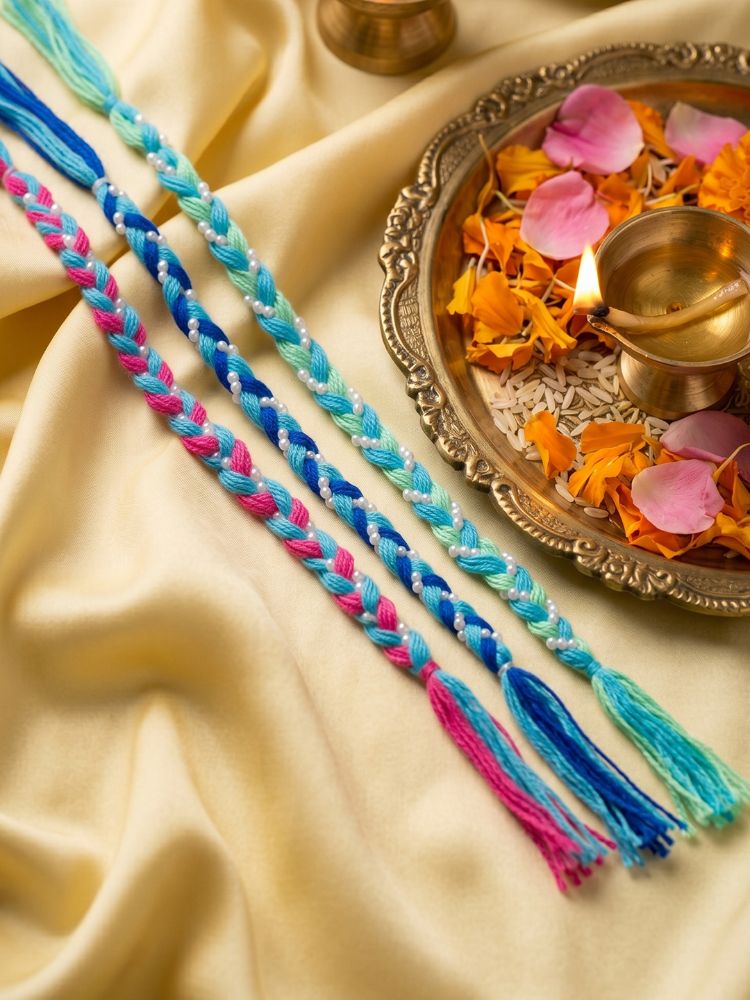 NVR Set of 3 Multicolor Thread Rakhi with Roli Chawal Chandan Mishri | Grocsy