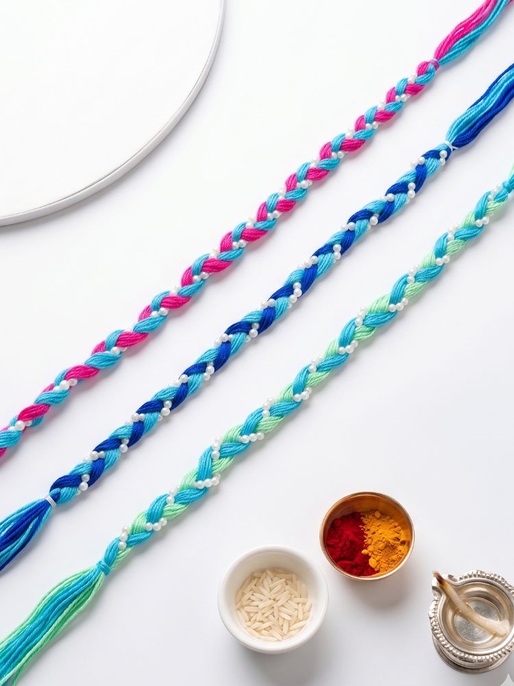 NVR Set of 3 Multicolor Thread Rakhi with Roli Chawal Chandan Mishri | Grocsy