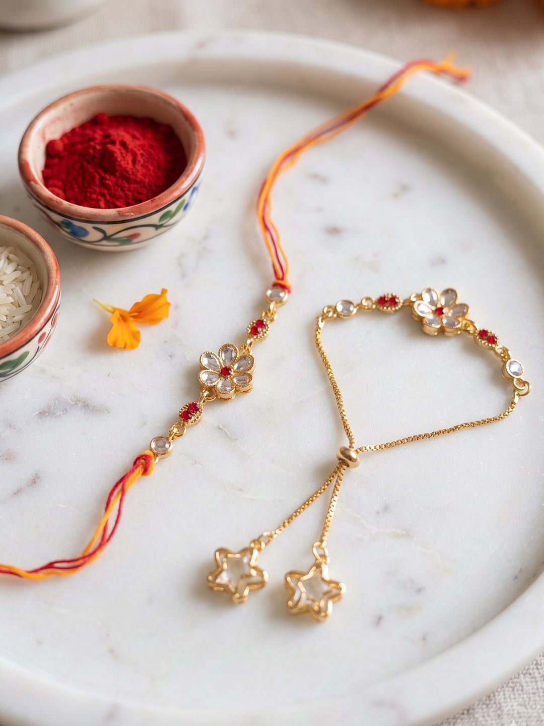 NVR Set of 2 Gold Toned Kundan Studded Bhaiya Bhabhi Rakhi with Roli Chawal Chandan Mishri | Grocsy