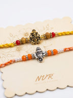 NVR Set of 2 Multicolor Religious Thread Rakhi with Roli Chawal Chandan Mishri | Grocsy