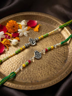 NVR Set of 2 Multicolor Religious Thread Rakhi with Roli Chawal Chandan Mishri | Grocsy