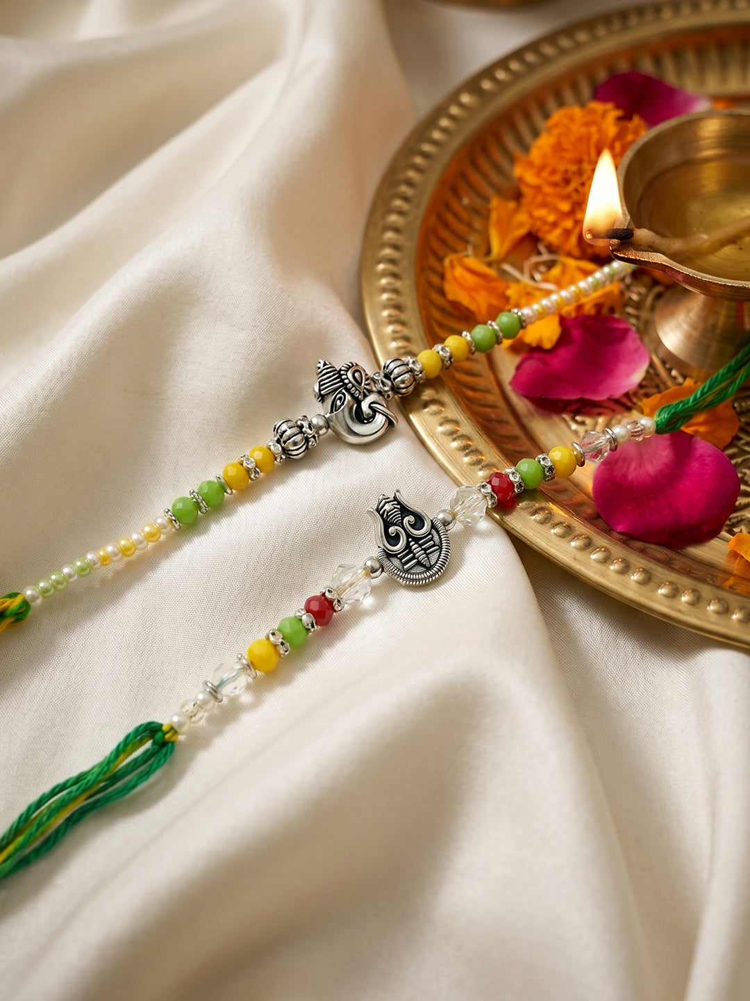 NVR Set of 2 Multicolor Religious Thread Rakhi with Roli Chawal Chandan Mishri | Grocsy