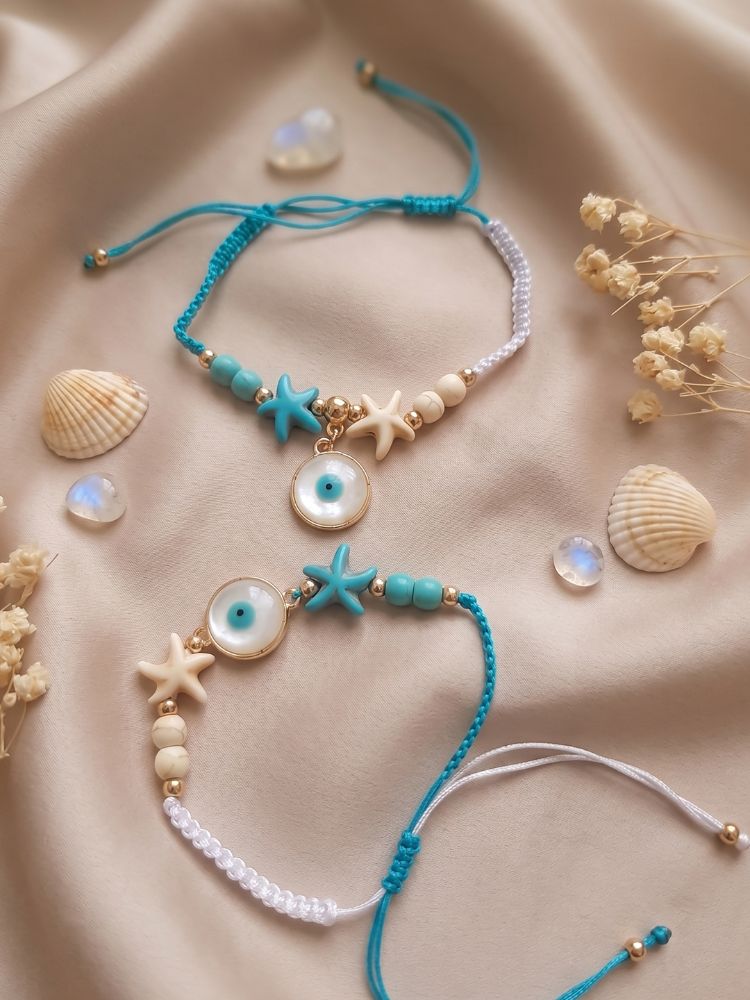 NVR Set of 2 Blue Evil Eye & White Pearl Bhaiya Bhabhi Rakhi with Roli Chawal Chandan | Grocsy