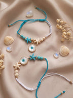 NVR Set of 2 Blue Evil Eye & White Pearl Bhaiya Bhabhi Rakhi with Roli Chawal Chandan | Grocsy