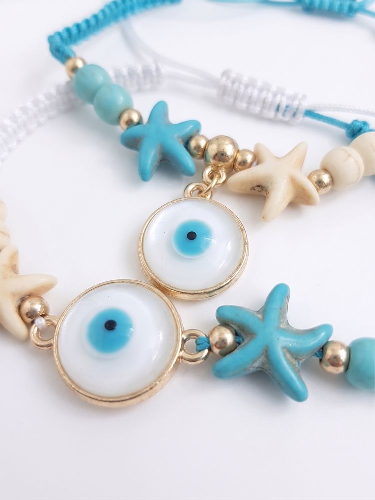 NVR Set of 2 Blue Evil Eye & White Pearl Bhaiya Bhabhi Rakhi with Roli Chawal Chandan | Grocsy