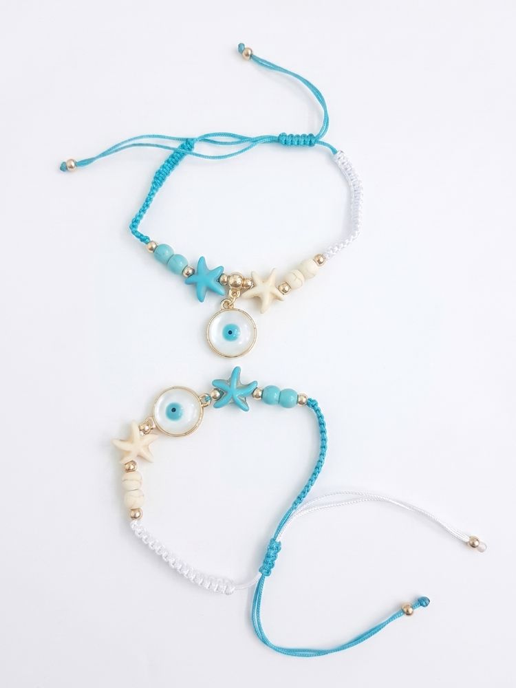 NVR Set of 2 Blue Evil Eye & White Pearl Bhaiya Bhabhi Rakhi with Roli Chawal Chandan | Grocsy