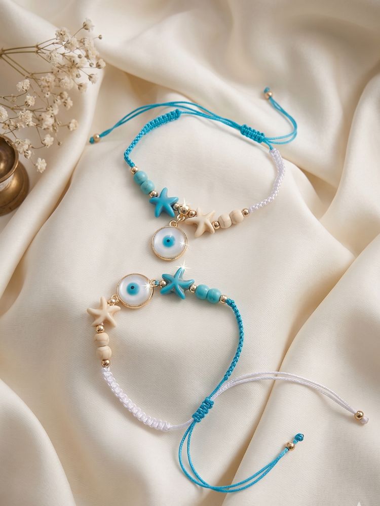 NVR Set of 2 Blue Evil Eye & White Pearl Bhaiya Bhabhi Rakhi with Roli Chawal Chandan | Grocsy