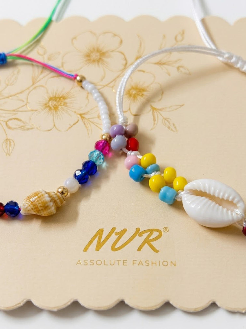 NVR Set of 2 Artificial Beads Thread Rakhi With Roli Chawal Chandan Mishri | Grocsy