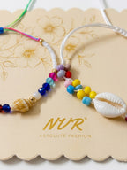 NVR Set of 2 Artificial Beads Thread Rakhi With Roli Chawal Chandan Mishri | Grocsy