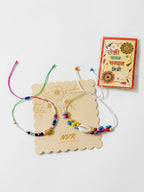 NVR Set of 2 Artificial Beads Thread Rakhi With Roli Chawal Chandan Mishri | Grocsy
