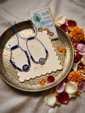 NVR Set of 2 Blue Evil Eye Thread Rakhi With Roli Chawal Chandan Mishri | Grocsy