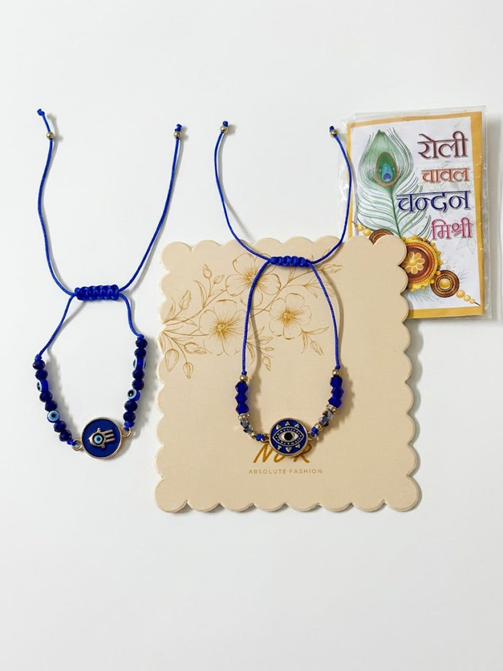 NVR Set of 2 Blue Evil Eye Thread Rakhi With Roli Chawal Chandan Mishri | Grocsy