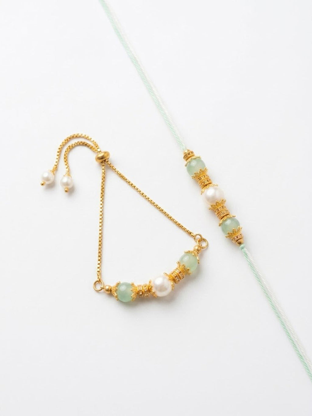 NVR Set of 2 Gold Toned Pearls & Artificial Beads Bhaiya Bhabhi Rakhi with Roli Chawal | Grocsy