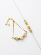 NVR Set of 2 Gold Toned Pearls & Artificial Beads Bhaiya Bhabhi Rakhi with Roli Chawal | Grocsy